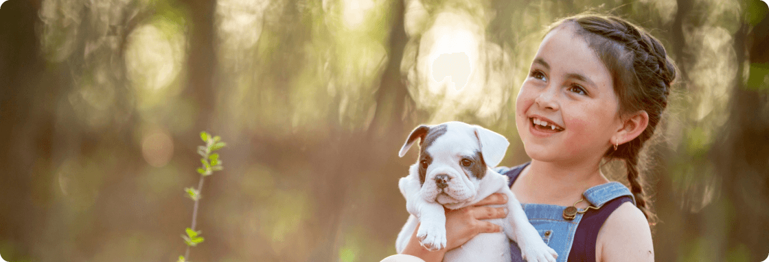 Girl holding puppy