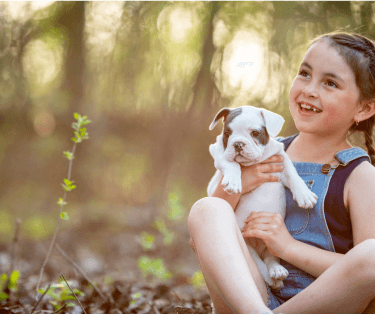 Girl holding puppy